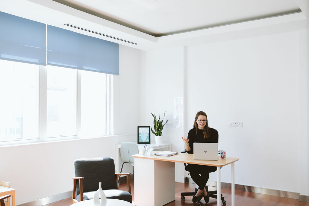 Psychologist at Vivamus clinic in Dubai welcoming a client via video call.