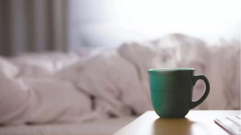 Person resting in bed to illustrate the link between ADHD and sleep challenges