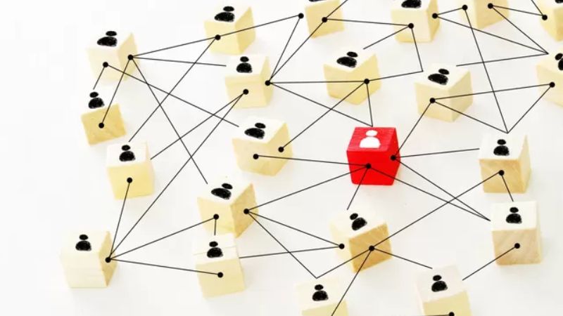 Network of connected wooden blocks representing neurodiversity and social connection