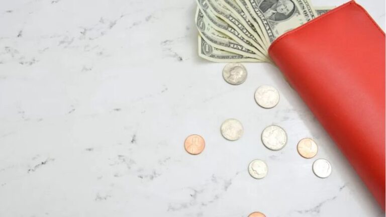 Image of wallet and coins symbolising financial stress in relationships